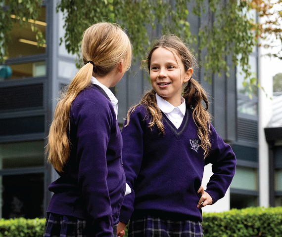 Two school girls talking